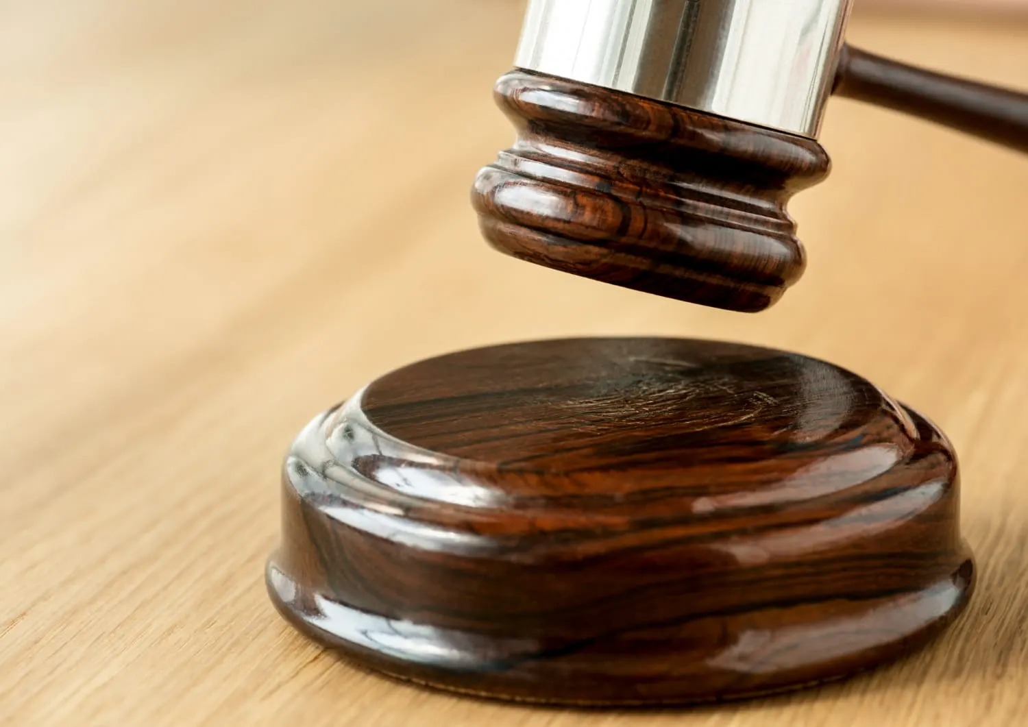 judge hitting a gavel during hearing