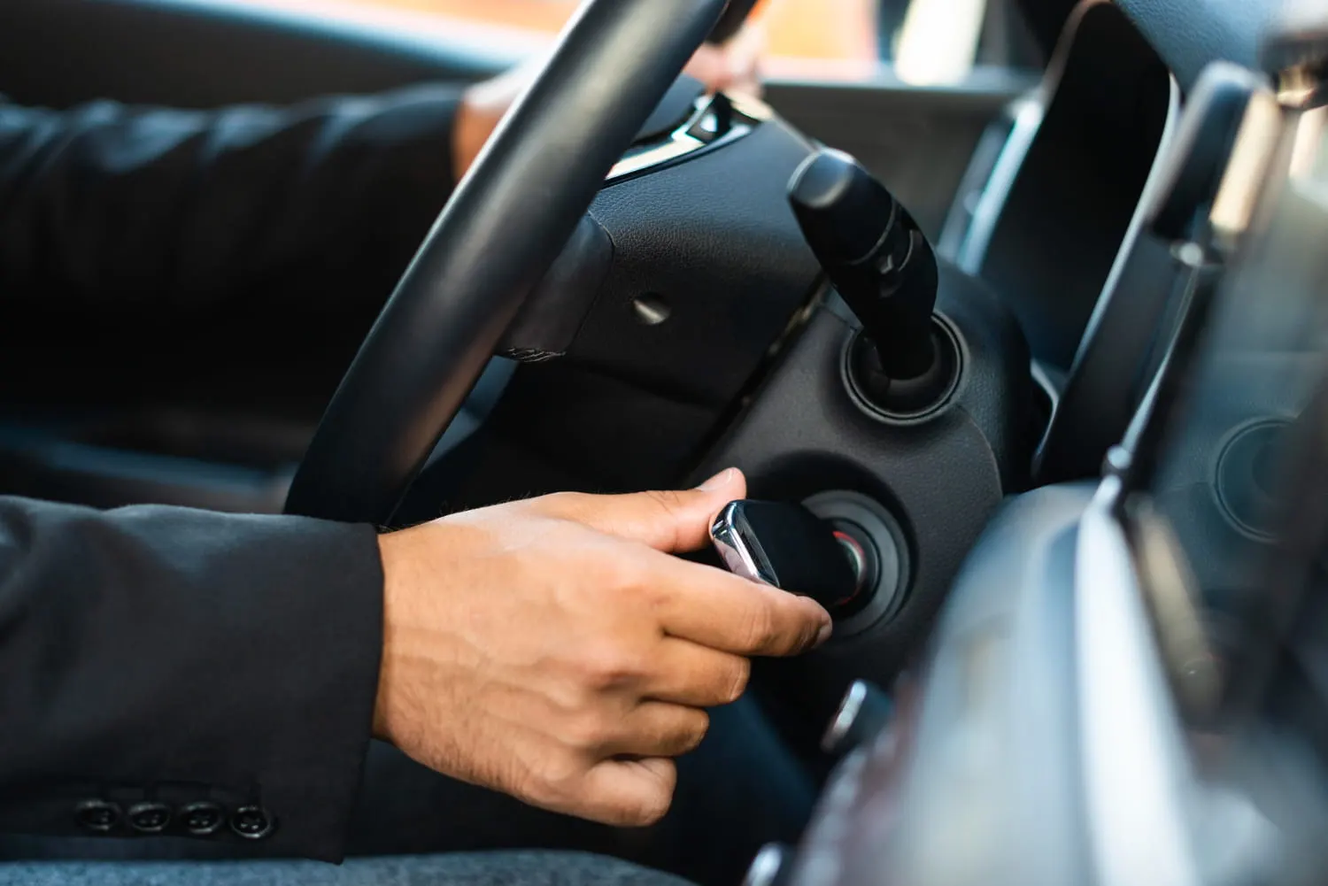 man starting the car