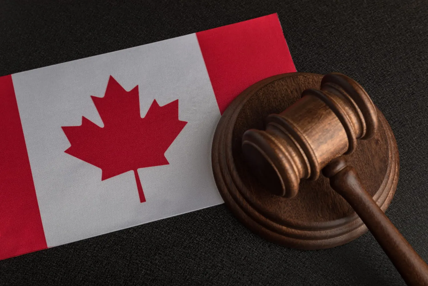 gavel lying next to canada flag
