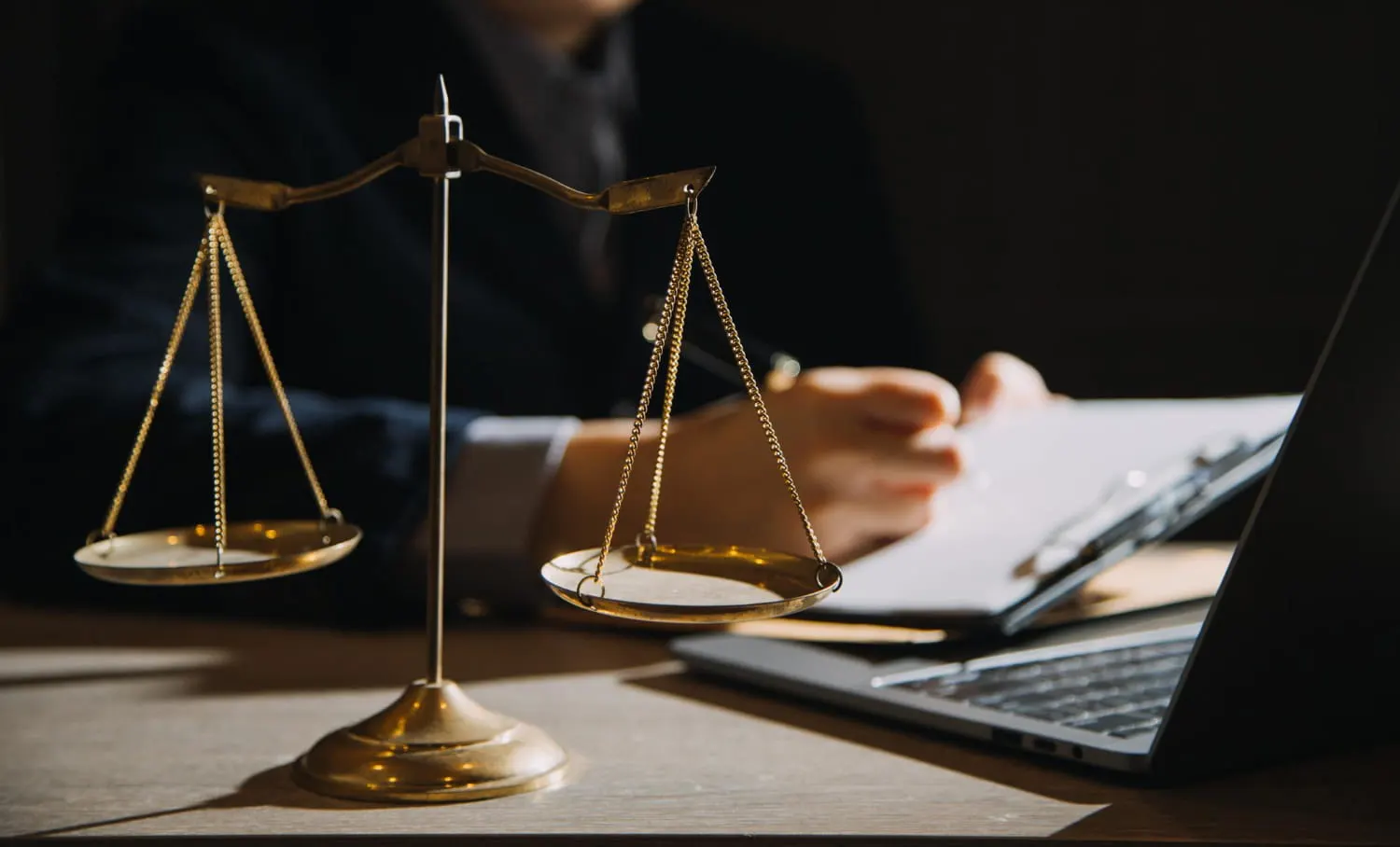 scales of justice on lawyer's desk