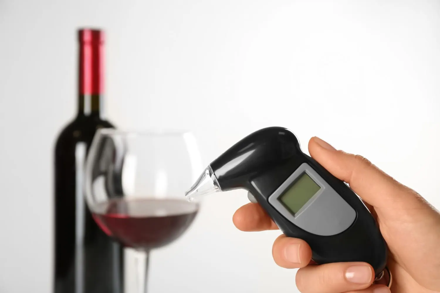 breath test device and wine bottle