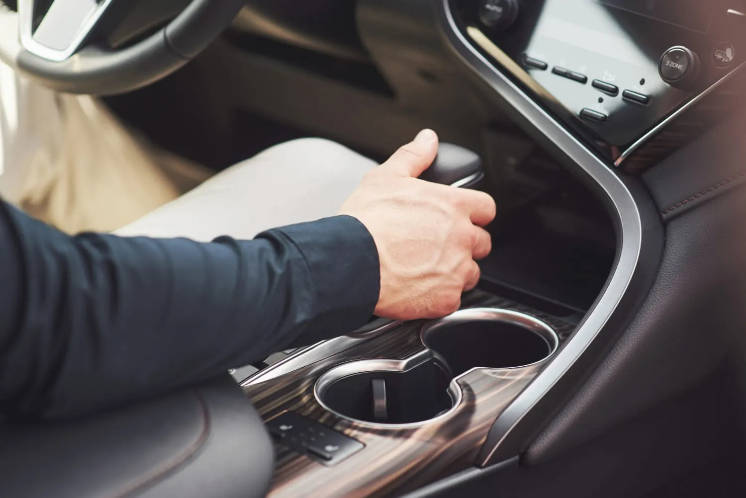 close up of a man driving a car