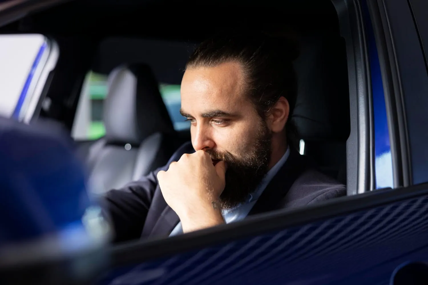man sitting in the driver's seat